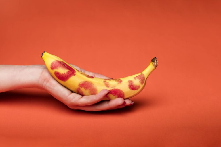 a person holding yellow banana fruit