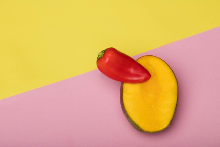 a red pepper in a sliced mango