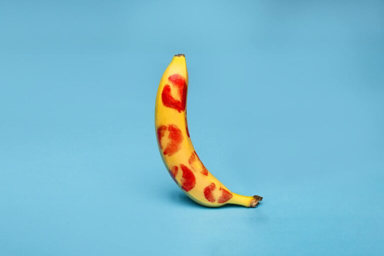 close up shot of a fresh banana on blue background